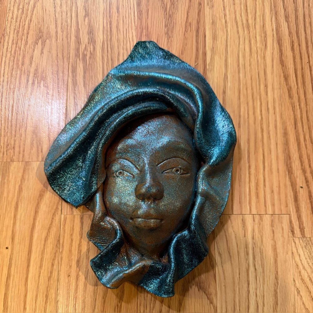Handcrafted Leather Face mask with headwrap,showing a unique artistic style.